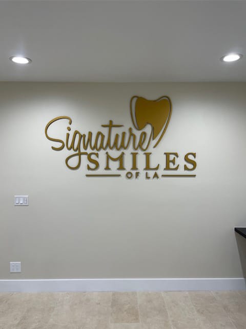 Dental Office Encino - our logo on the office wall